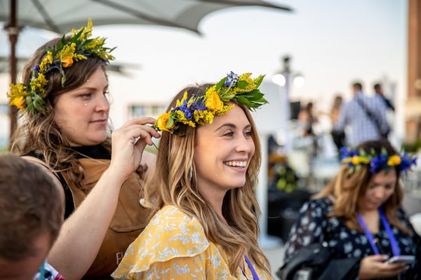 smiling attendee wearing a flower crown