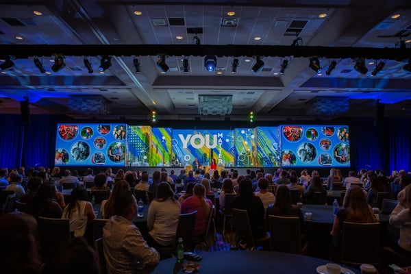 Genentech Pharmaceutical Meeting stage and crowd