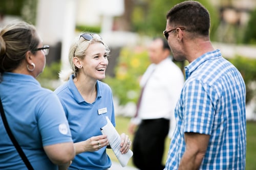 event staff and participant happily chatting