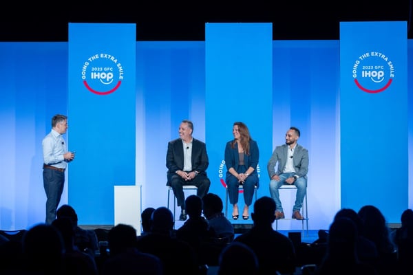 panel on stage at corporate event