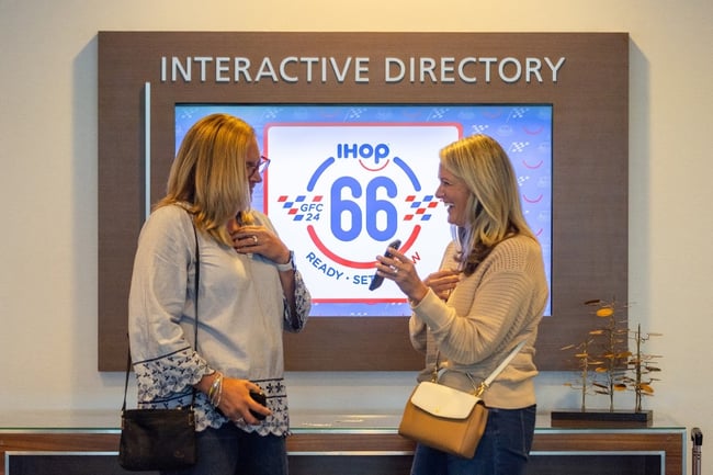Event attendees sharing a lighthearted moment at an iHOP conference