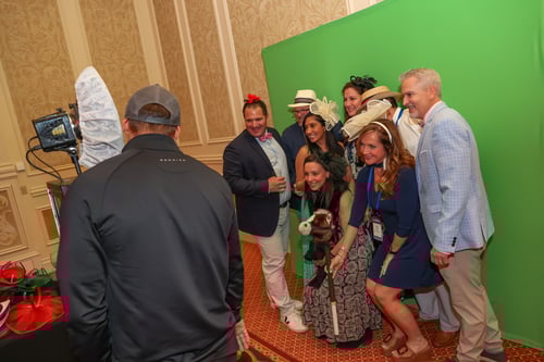 Group photo with props in front of a green screen