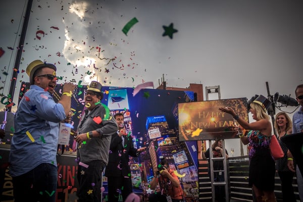 event attendees celebrate a mock new year's eve to mark a milestone