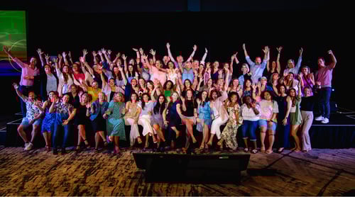 big group photo on stage at event