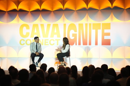 Engaging discussion on colorful stage at a conference