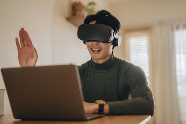 Man interacts with virtual event via VR Headset