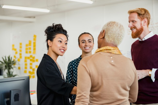 Group of multi-racial individuals network at franchise event1182852701