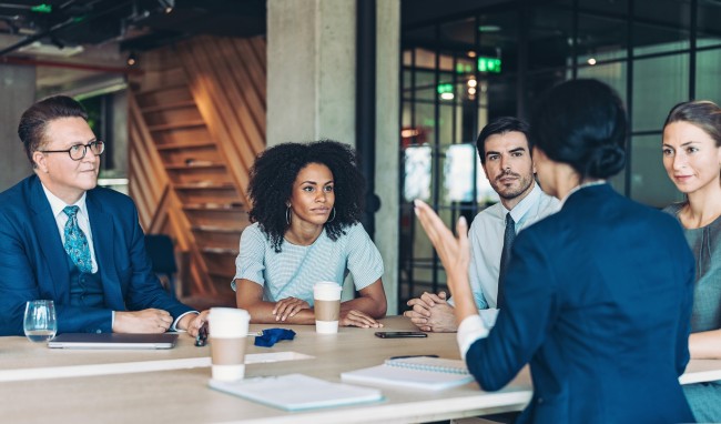 diverse individuals at table event budget planning