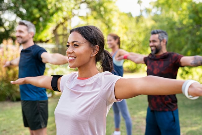 diverse group does yoga at a corporate event