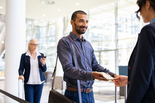 person showing airport employee his phone