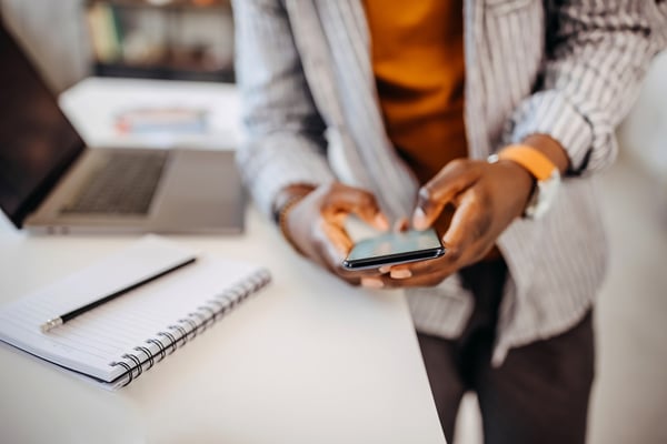 woman uses event app on phone 1356931964