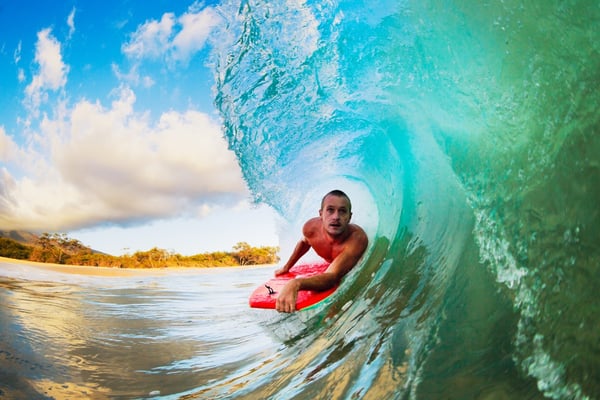 man surfing during incentive trip