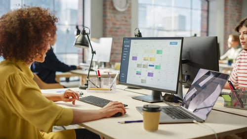 Business professional reviewing calendar on a desktop screen