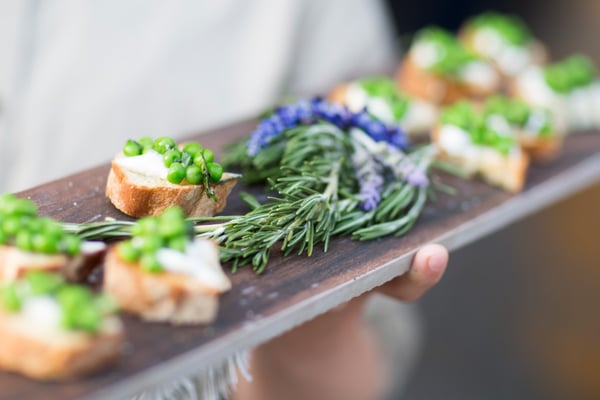Tray of food with herbs served at pharma event