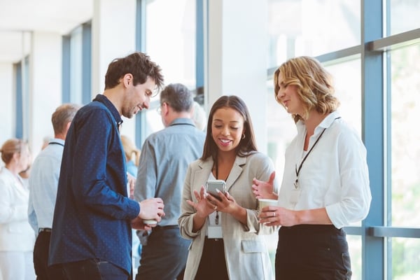 attendees using event app at corporate event