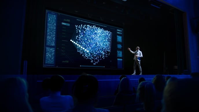 man in front of smart screen at event