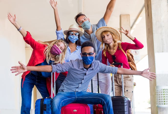 group of masked travelers AdobeStock_382619091