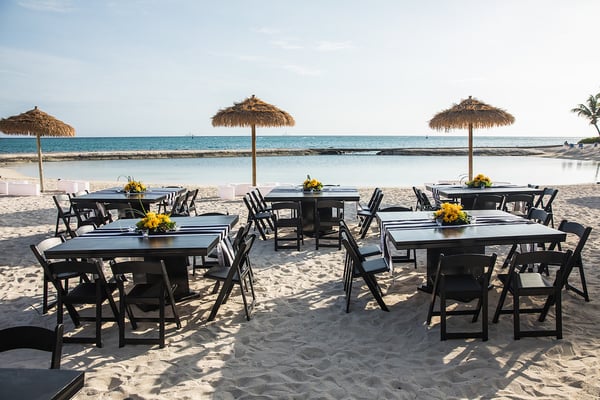 tables on beach for incentive trip dinner