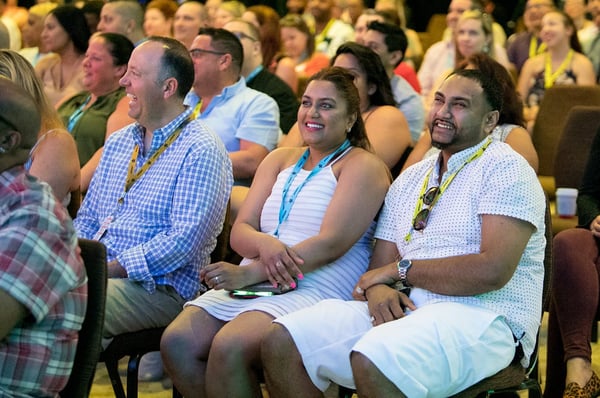 corporate event attendees enjoy a speaker