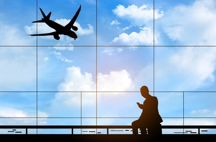 man in front of airport window AdobeStock_311583079