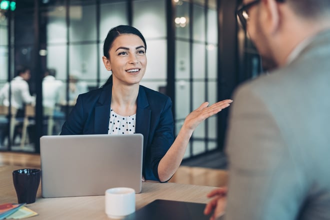 smiling woman with coworker