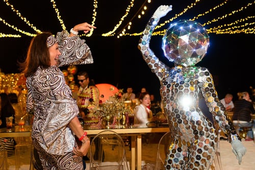 Person dressed like a disco ball dancing