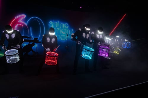illumination of people playing drums