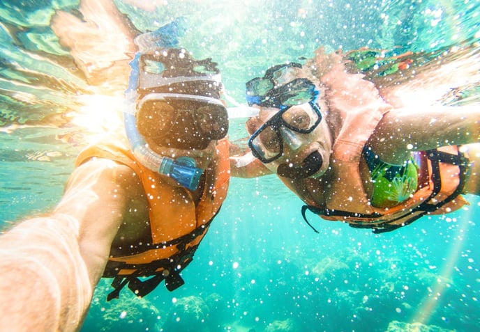 underwater snorkeling selfie with man and woman AdobeStock_192961661