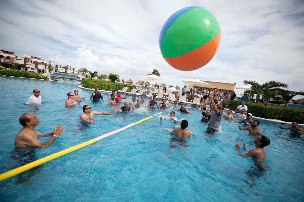 people playing beach ball volleyball in a pool at a corporate event 848A0976-2