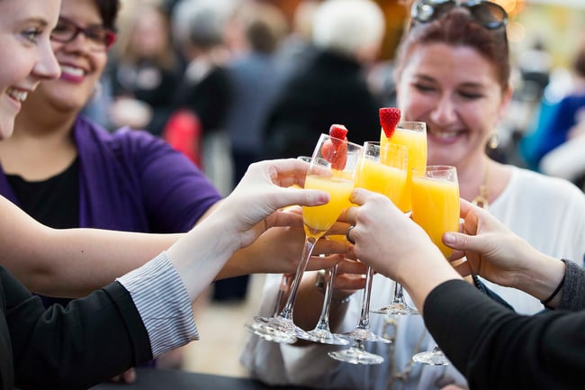 women toasting with mimosas